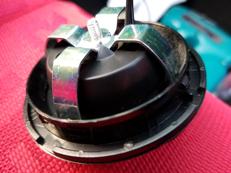 Mixing parts from two brackets and a piece of the heater vent resulted in this: not pretty from behind, but it gets the job done and looks good from the front.